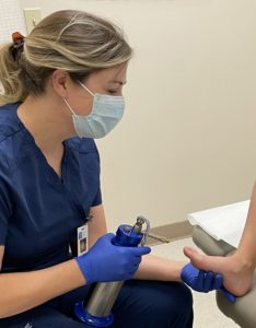 pediatric dermatologist dr. elizabeth froelich treating wart on child 